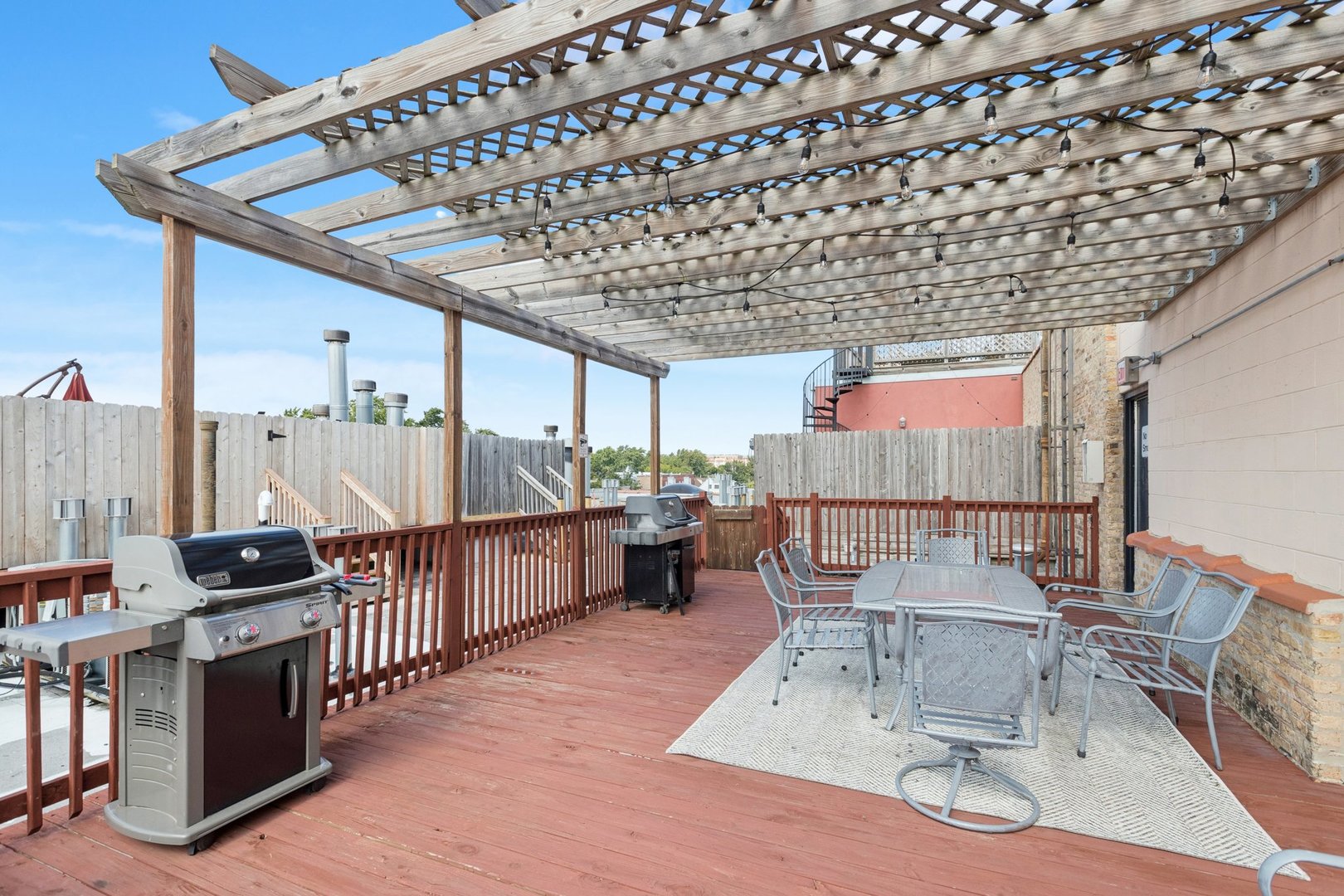3201 North Ravenswood Avenue, Unit 301 Chicago, IL 60657 - Photo 35 of 38 a room with lots of furniture and lots of wooden furniture