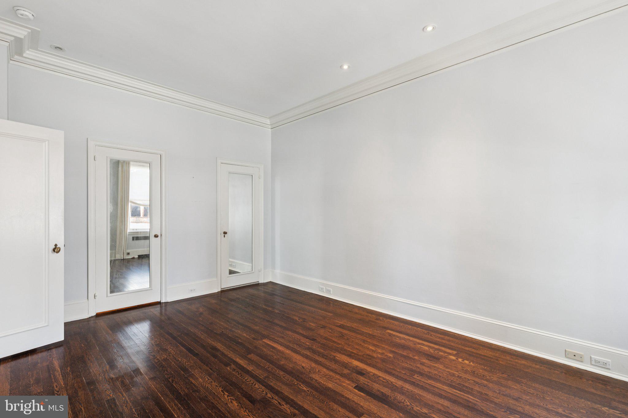 237-47 South 18th Street, Unit 4D Philadelphia, PA 19103 - Photo 9 of 19 a view of an empty room with wooden floor