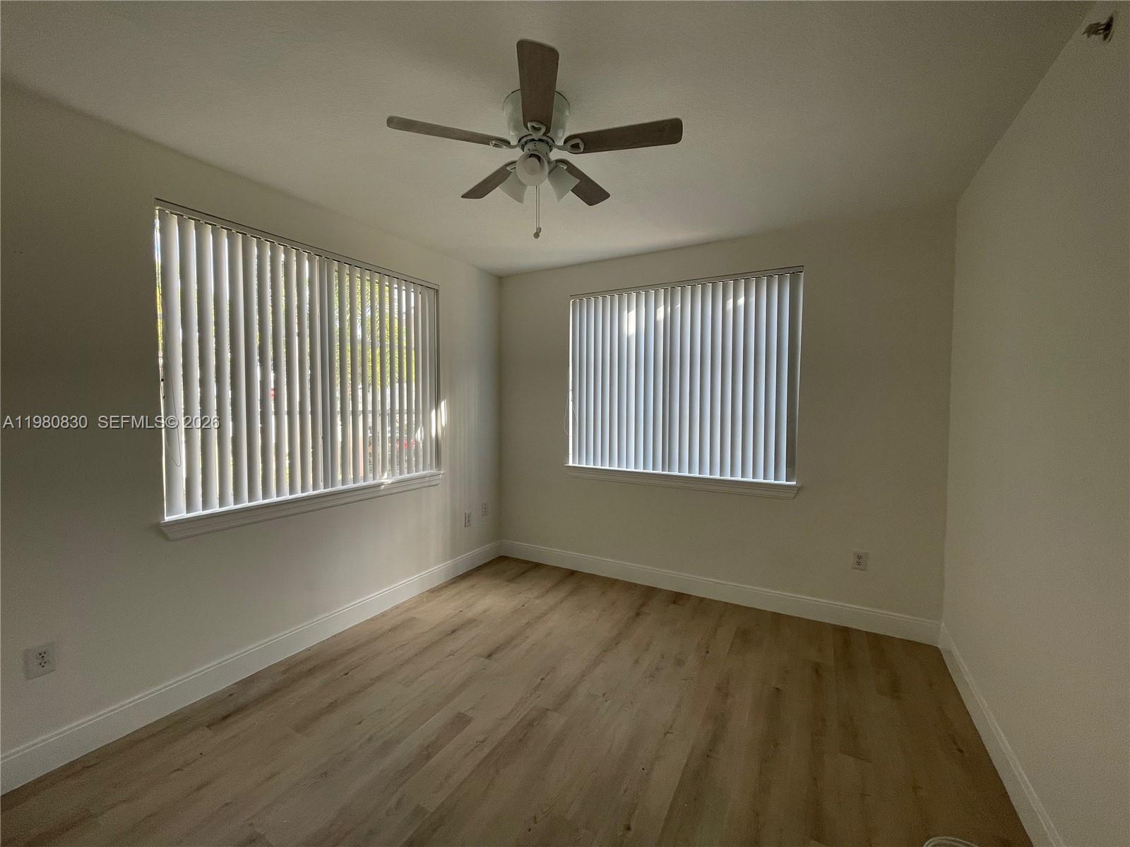 6821 Southwest 44th Street, Unit 301 Miami, FL 33155 - Photo 2 of 12 a view of an empty room with a window
