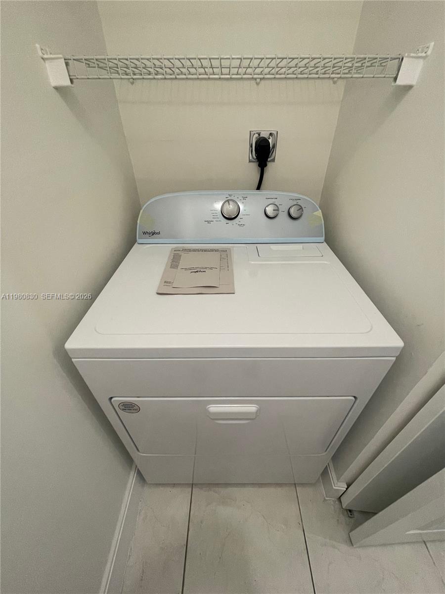 6821 Southwest 44th Street, Unit 301 Miami, FL 33155 - Photo 8 of 12 a utility room with washer and dryer