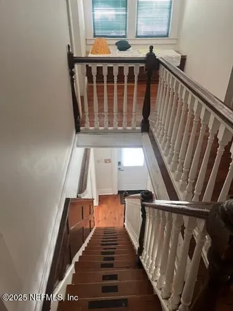 a view of entryway with wooden floor
