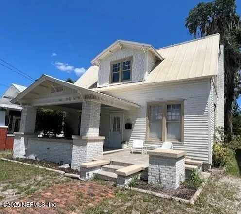 a front view of a house with a porch