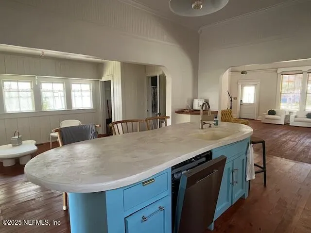 a bathroom with a granite countertop sink a large mirror and vanity