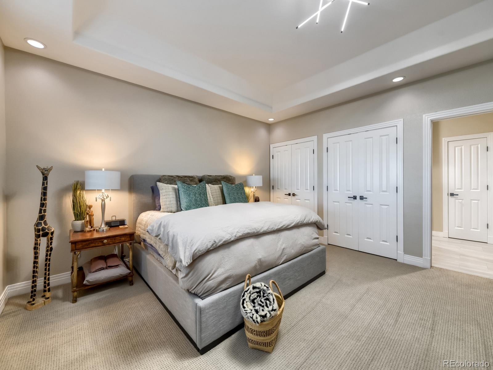 730 Genesee Mountain Road Golden, CO 80401 - Photo 36 of 50 a spacious bedroom with a bed and a couch