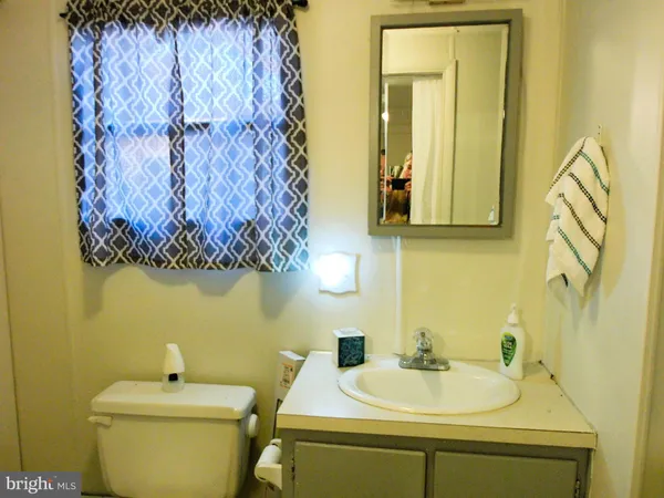 a bathroom with a toilet and a sink