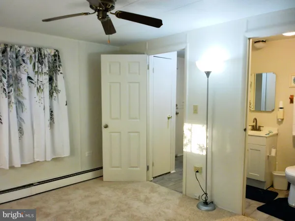 a bathroom with a shower and a sink