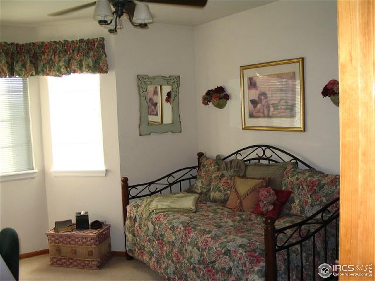 10015 Silver Maple Road Littleton, CO 80129 - Photo 8 of 11 a bedroom with a bed and a window