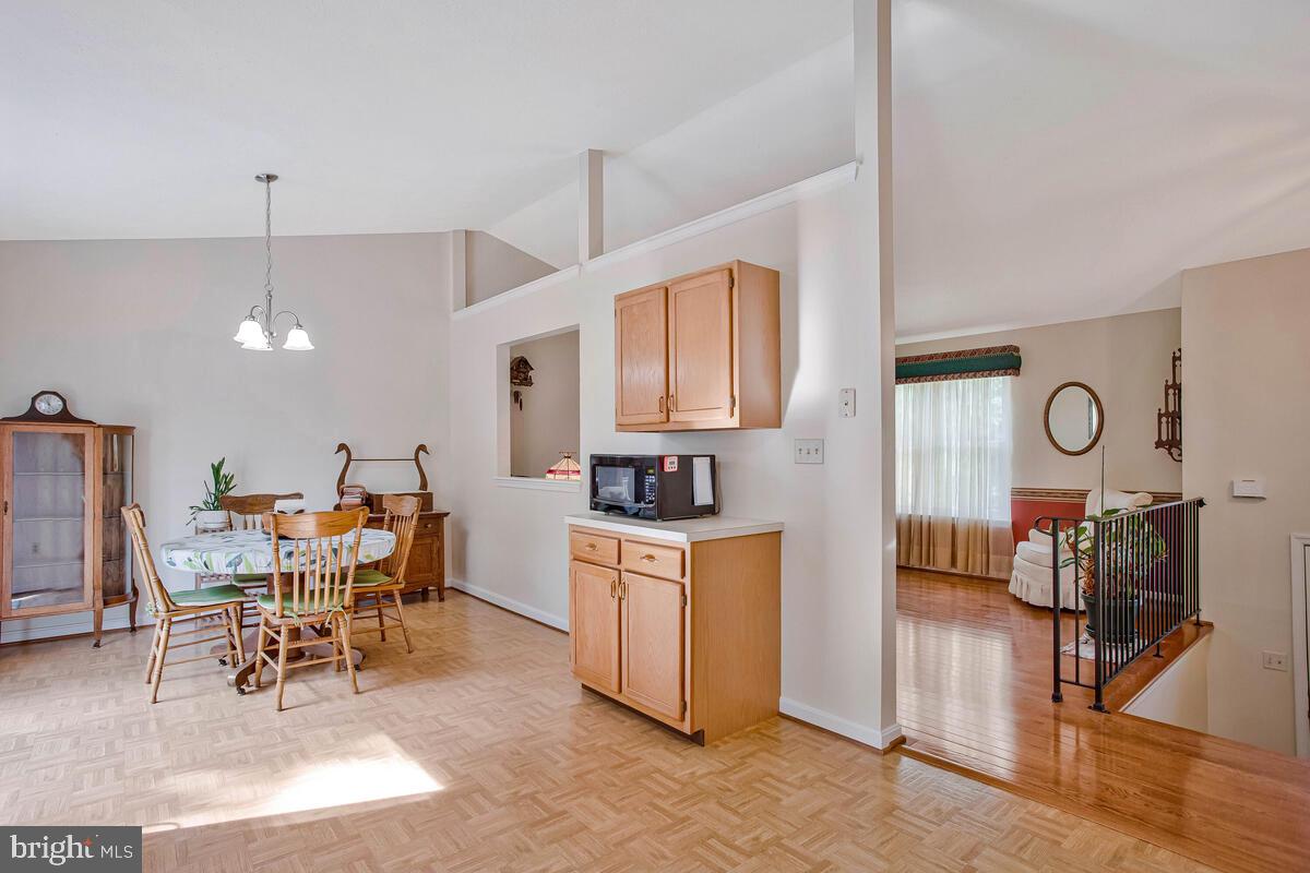 70 South View Drive Huntingtown, MD 20639 - Photo 12 of 34 a view of a kitchen with a dining table and chairs