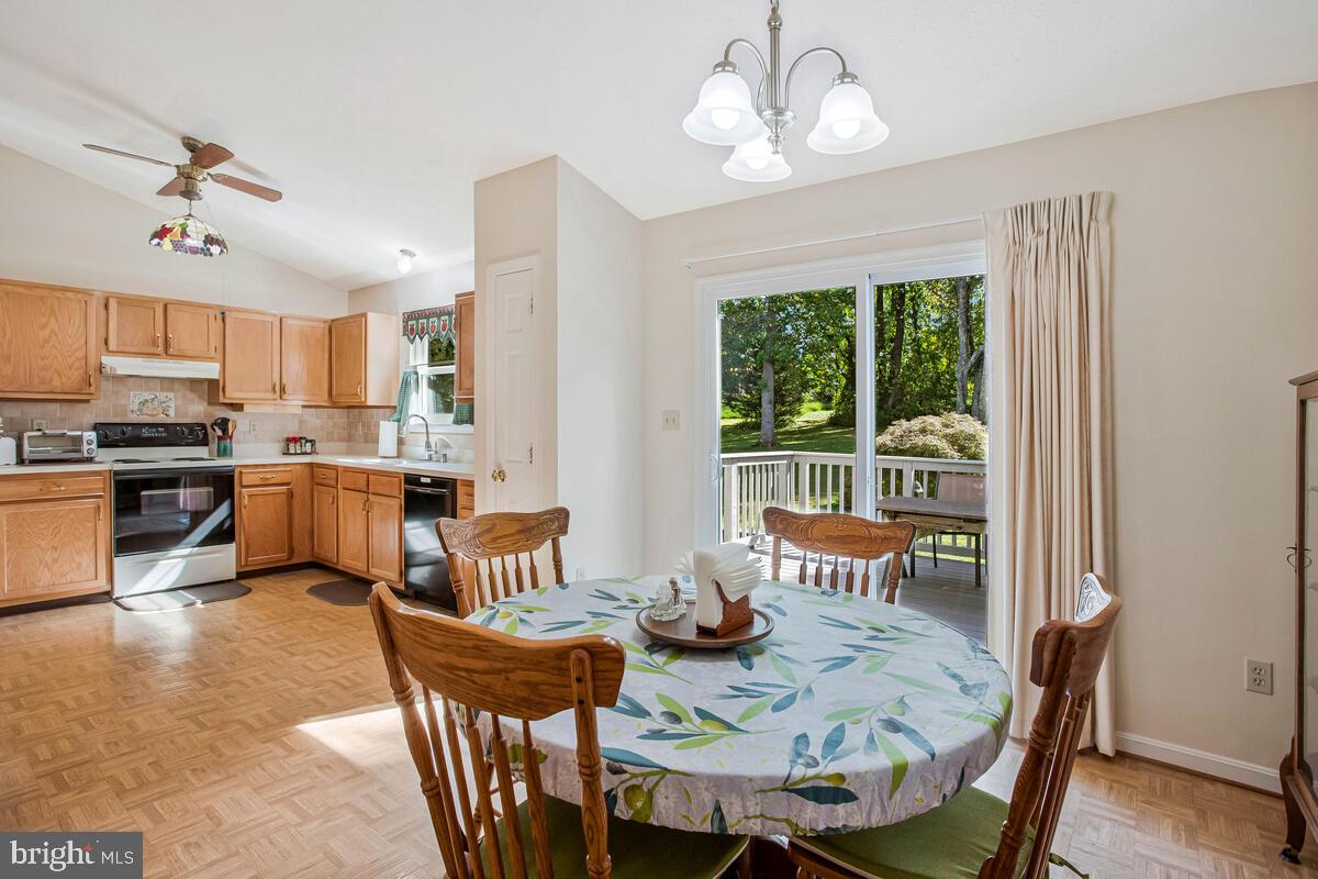 70 South View Drive Huntingtown, MD 20639 - Photo 14 of 34 a view of a dining room with furniture large window and wooden floor