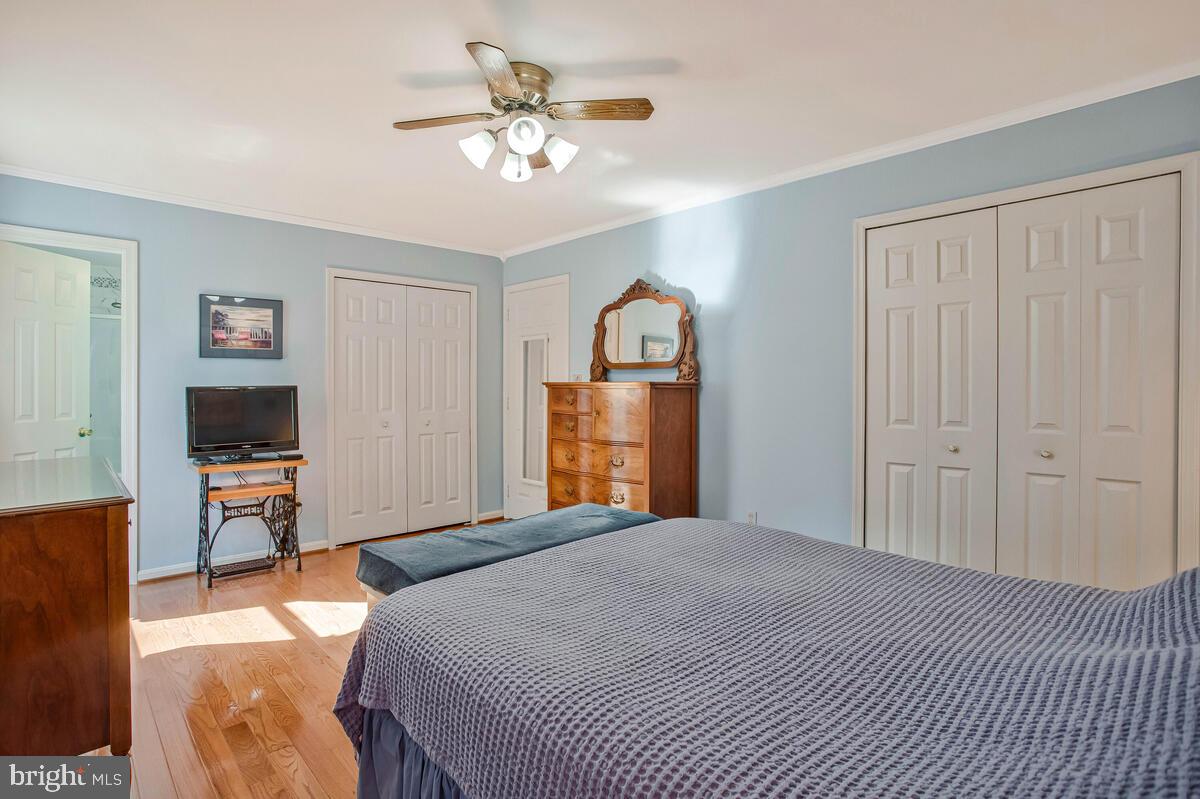 70 South View Drive Huntingtown, MD 20639 - Photo 16 of 34 a bedroom with a bed and a flat screen tv