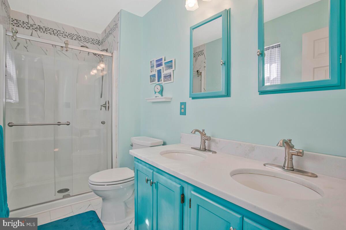 70 South View Drive Huntingtown, MD 20639 - Photo 17 of 34 a bathroom with a granite countertop sink mirror vanity and toilet