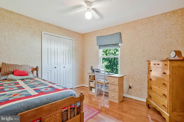 a bedroom with a bed and a table in it