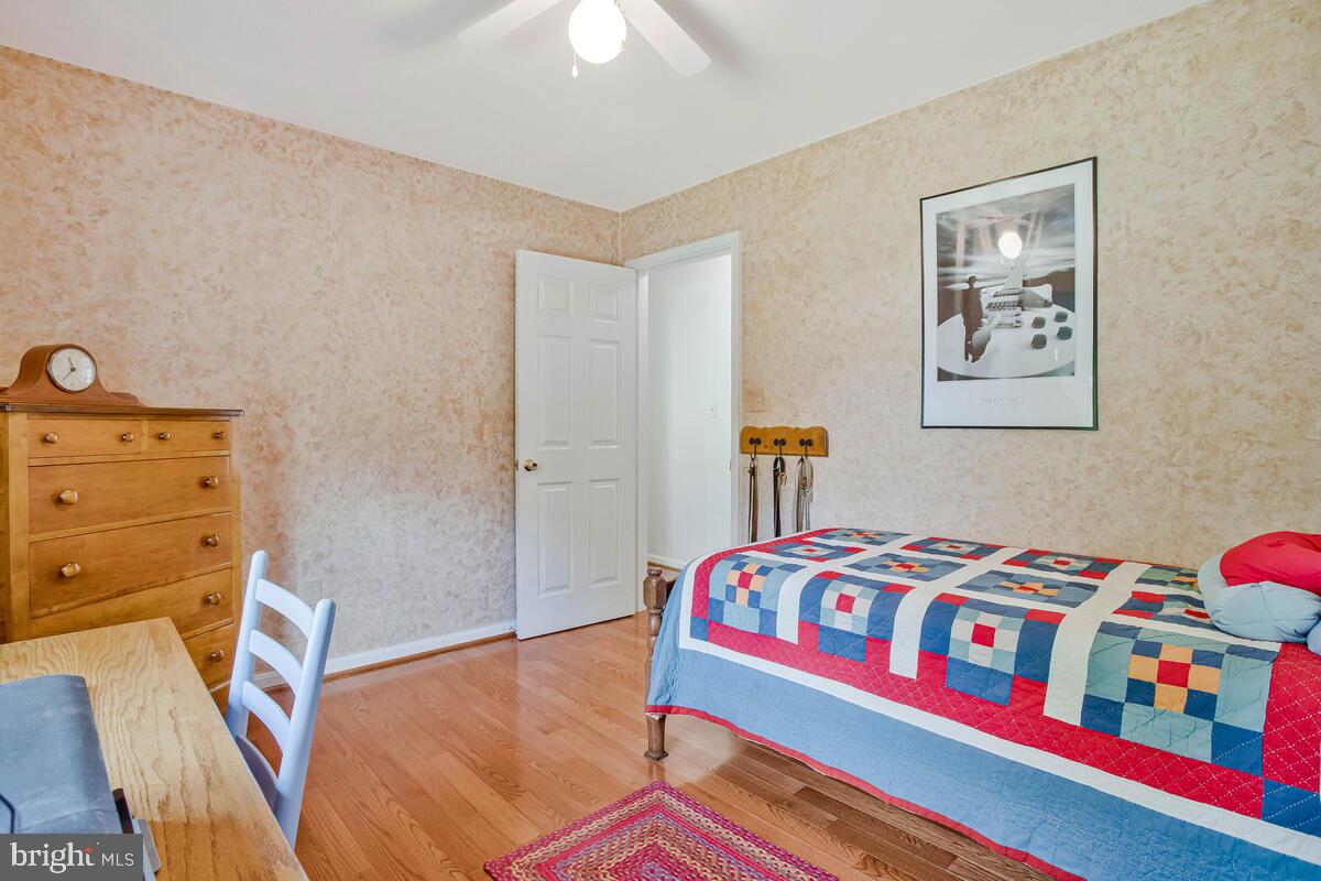 70 South View Drive Huntingtown, MD 20639 - Photo 19 of 34 a bedroom with a bed and a dresser in it