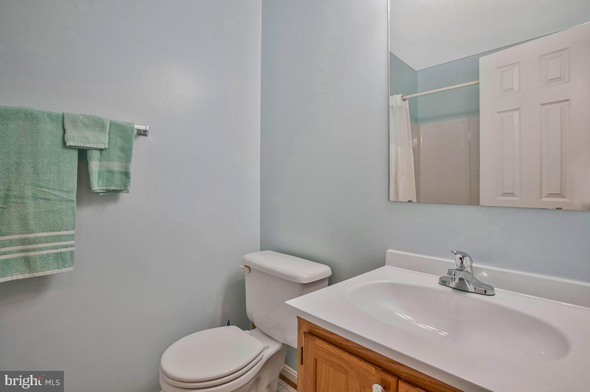 70 South View Drive Huntingtown, MD 20639 - Photo 26 of 34 a bathroom with a sink a toilet and mirror