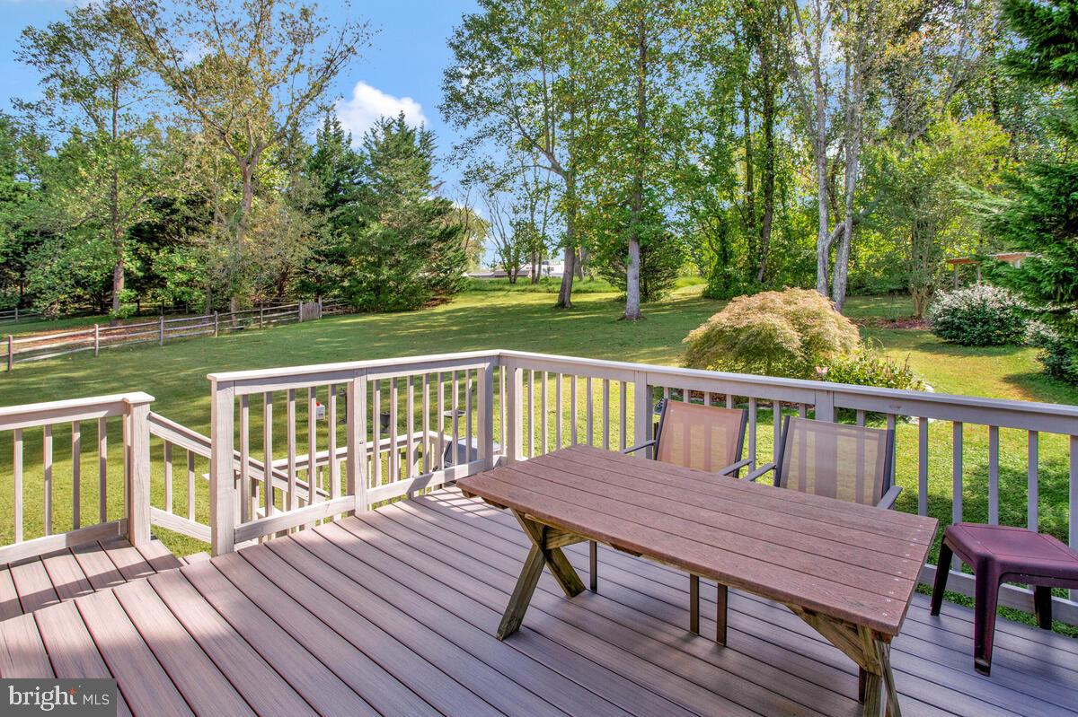 70 South View Drive Huntingtown, MD 20639 - Photo 27 of 34 a view of a deck with two chairs and wooden floor