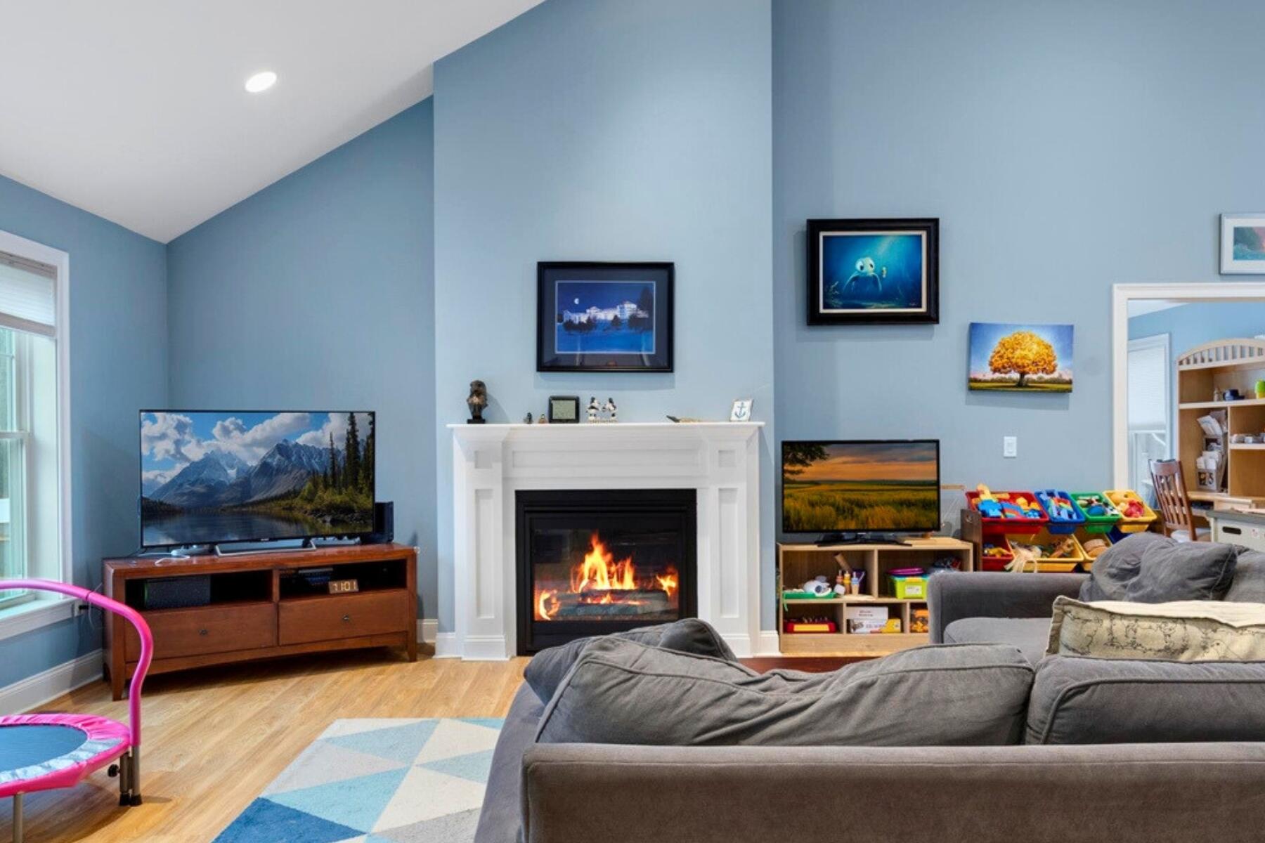 7 Maxwell Lane Sandwich, MA 02563 - Photo 15 of 54 a living room with furniture a flat screen tv and a fireplace