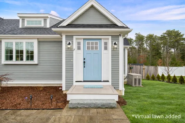 a front view of a house with garden