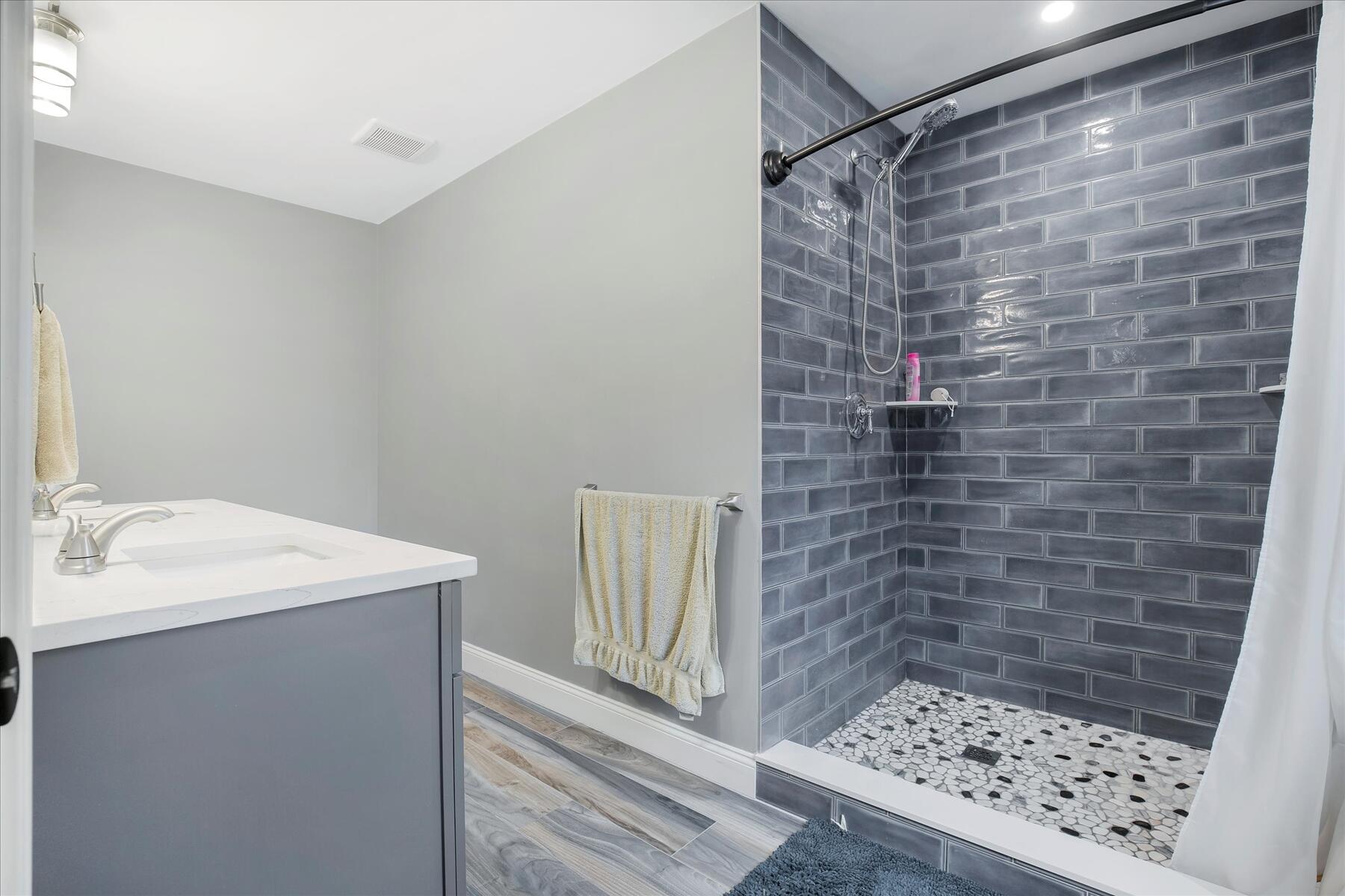 7 Maxwell Lane Sandwich, MA 02563 - Photo 22 of 54 a bathroom with a sink and a shower