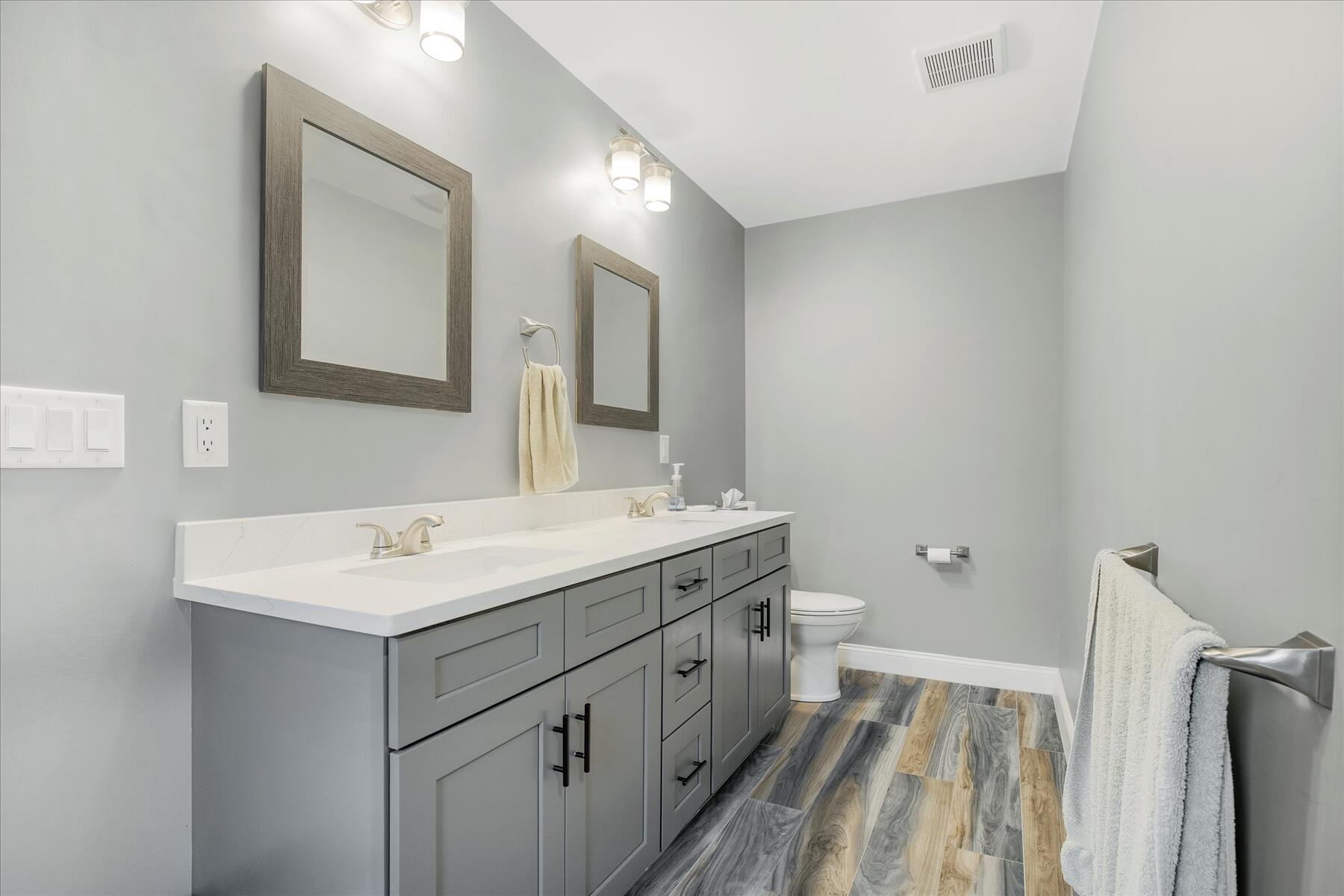 7 Maxwell Lane Sandwich, MA 02563 - Photo 23 of 54 a bathroom with a sink a toilet a mirror and vanity