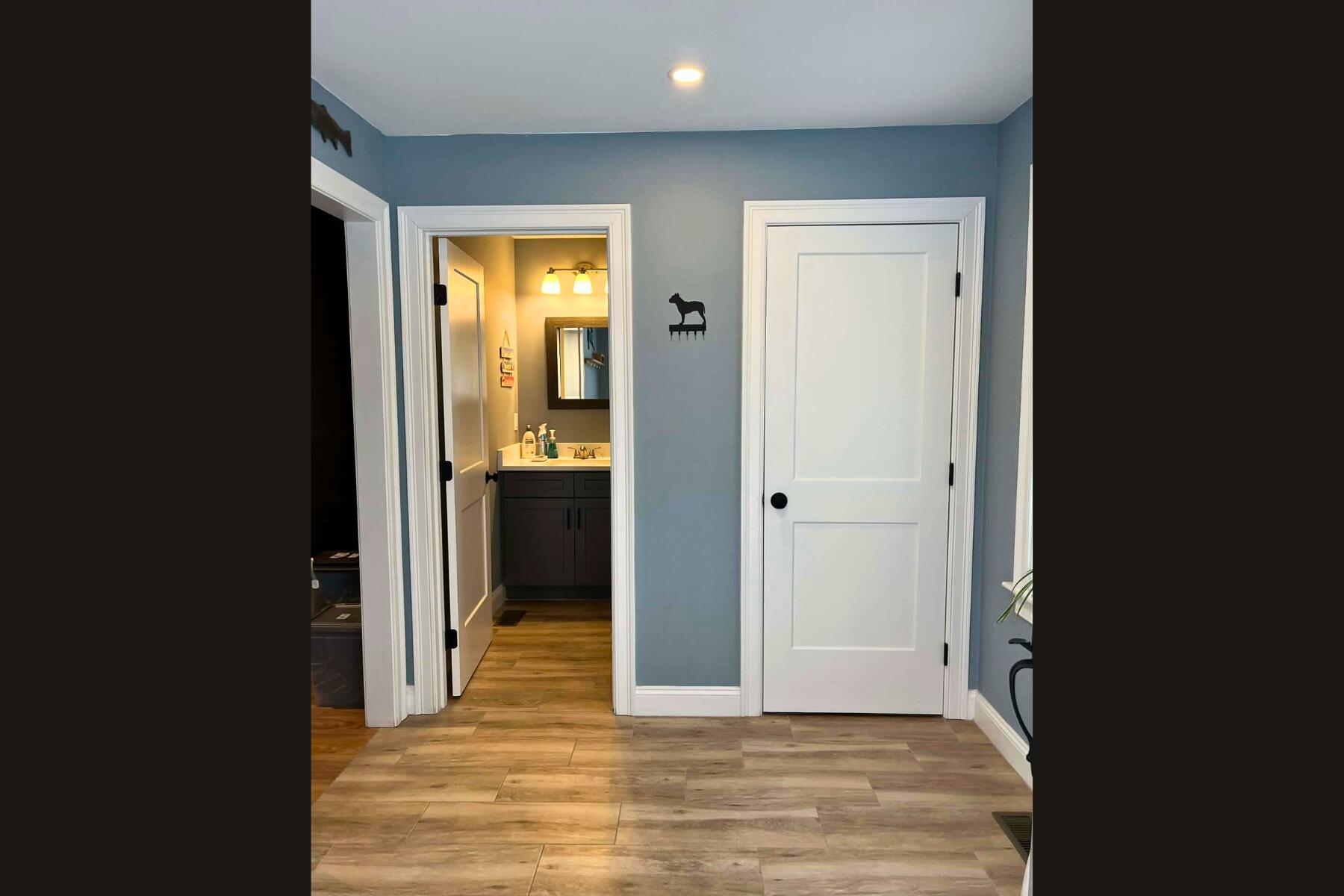 7 Maxwell Lane Sandwich, MA 02563 - Photo 4 of 54 a view of a hallway with wooden floor and a bathroom