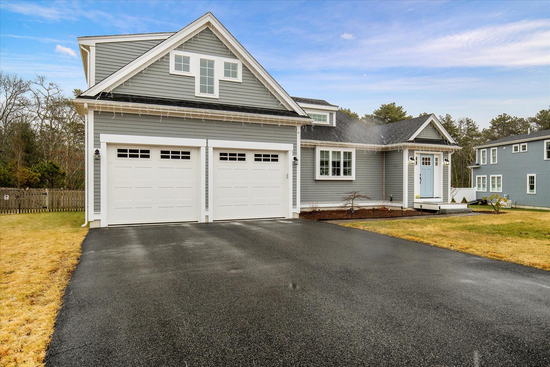 7 Maxwell Lane Sandwich, MA 02563 - Photo 49 of 54 a front view of a house with a yard