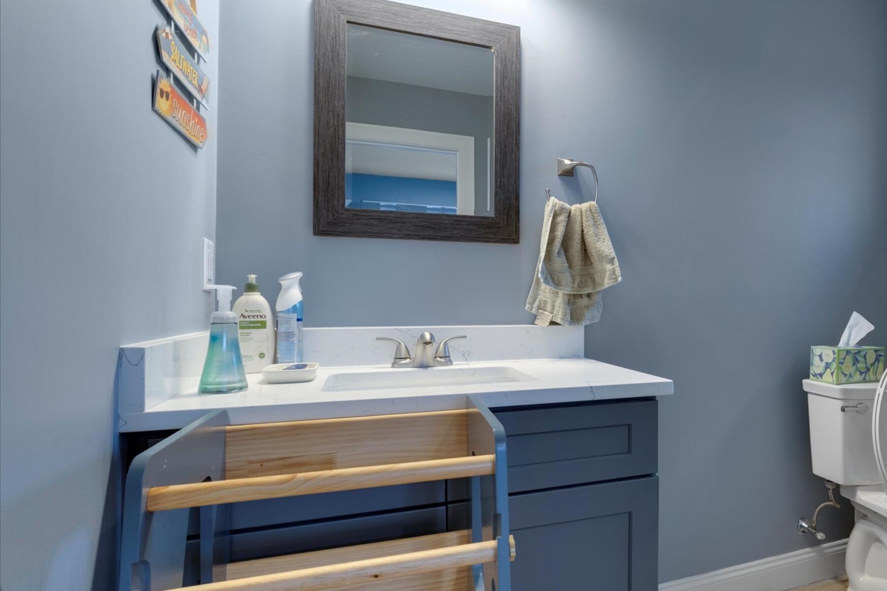 7 Maxwell Lane Sandwich, MA 02563 - Photo 7 of 54 a bathroom with a toilet sink and mirror