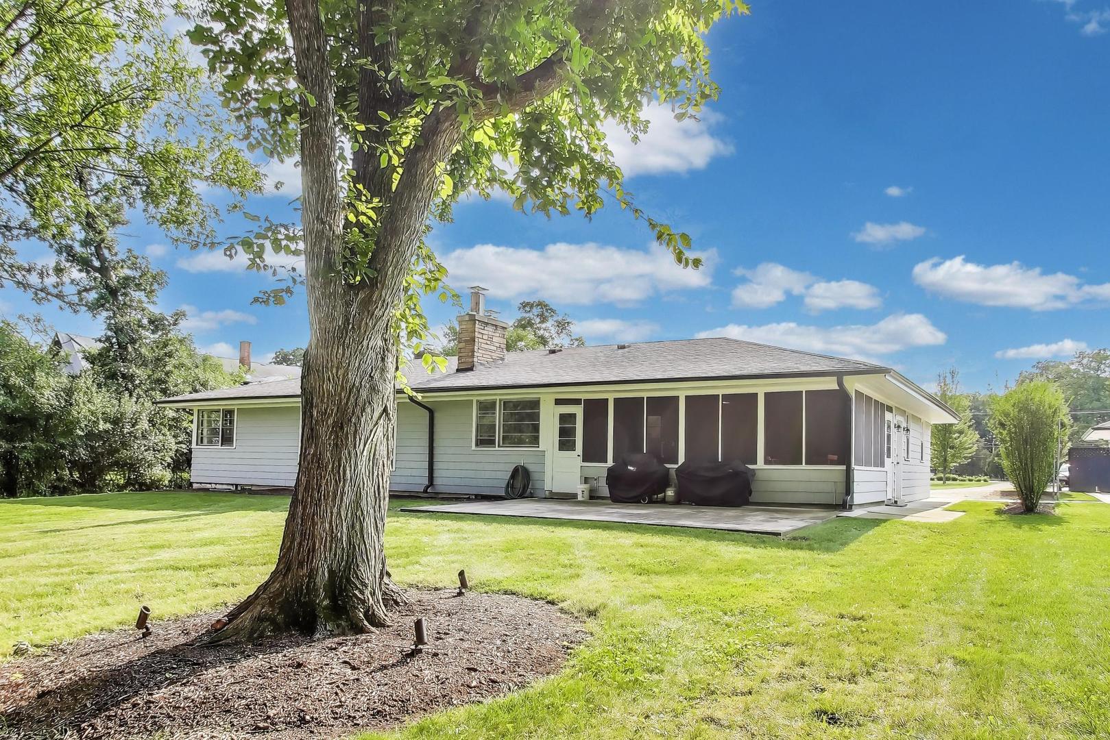 3801 Madison Street Oak Brook, IL 60523 - Photo 3 of 11 a front view of a house with garden