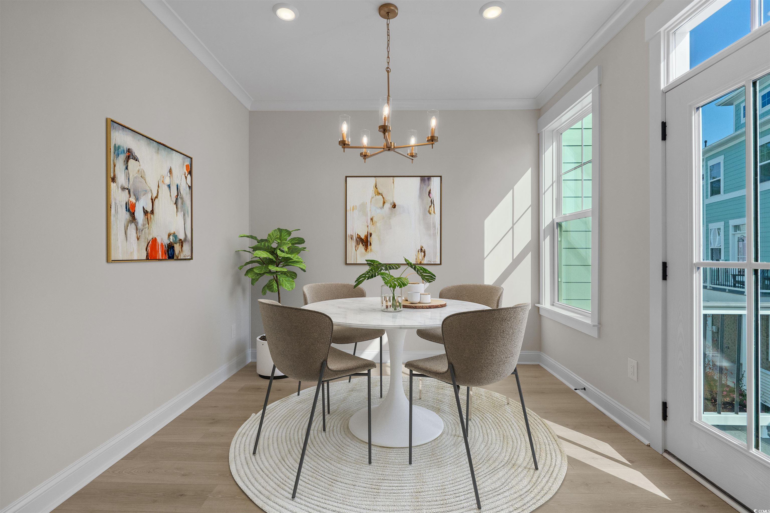 8476 Duke Place, Unit 32 Myrtle Beach, SC 29572 - Photo 11 of 40 Dining space featuring crown molding, light wood-style flooring, a chandelier, and recessed lighting