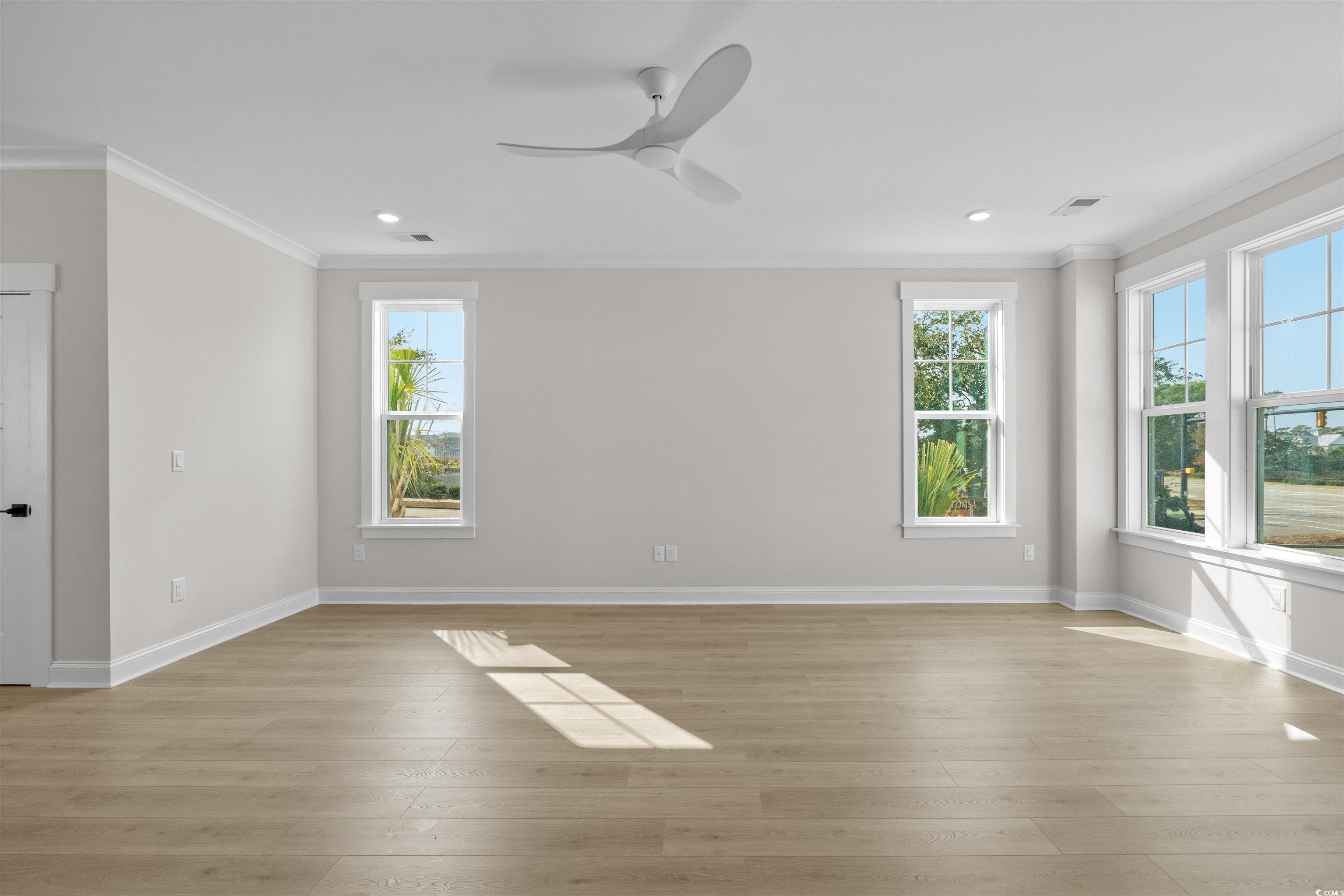 8476 Duke Place, Unit 32 Myrtle Beach, SC 29572 - Photo 16 of 40 Spare room with crown molding, light wood-type flooring, a ceiling fan, and recessed lighting