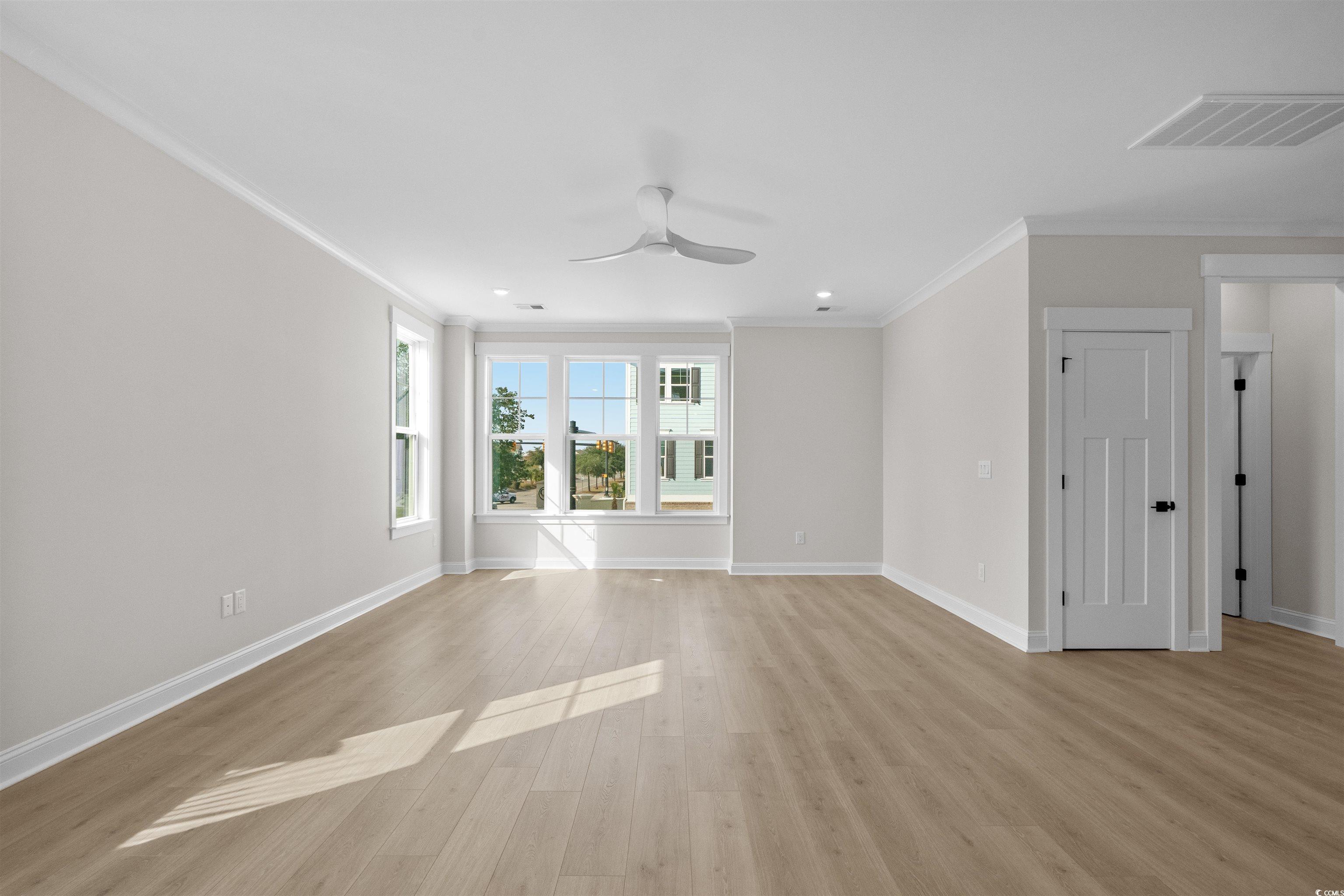 8476 Duke Place, Unit 32 Myrtle Beach, SC 29572 - Photo 17 of 40 Spare room with ornamental molding, light wood finished floors, a ceiling fan, and recessed lighting