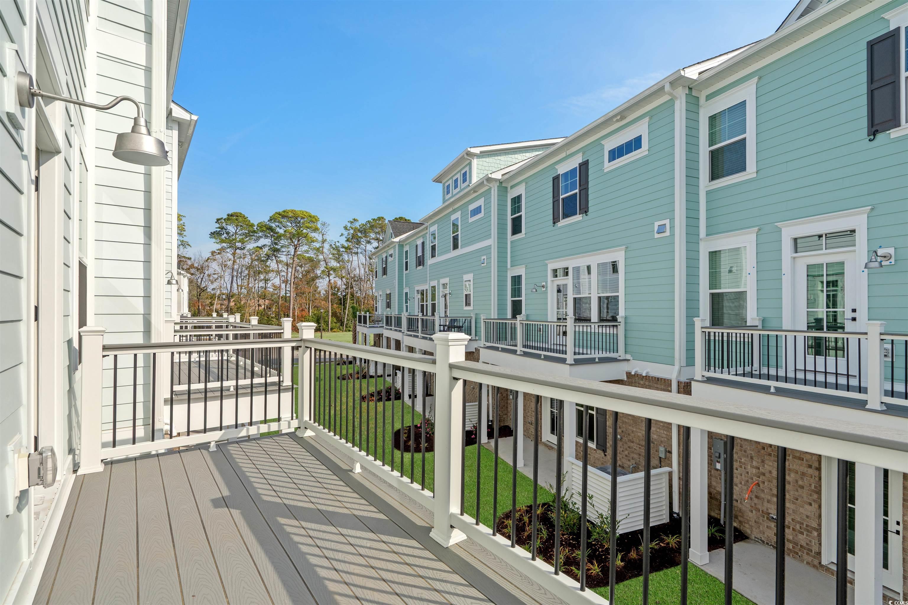 8476 Duke Place, Unit 32 Myrtle Beach, SC 29572 - Photo 20 of 40 Balcony with a residential view