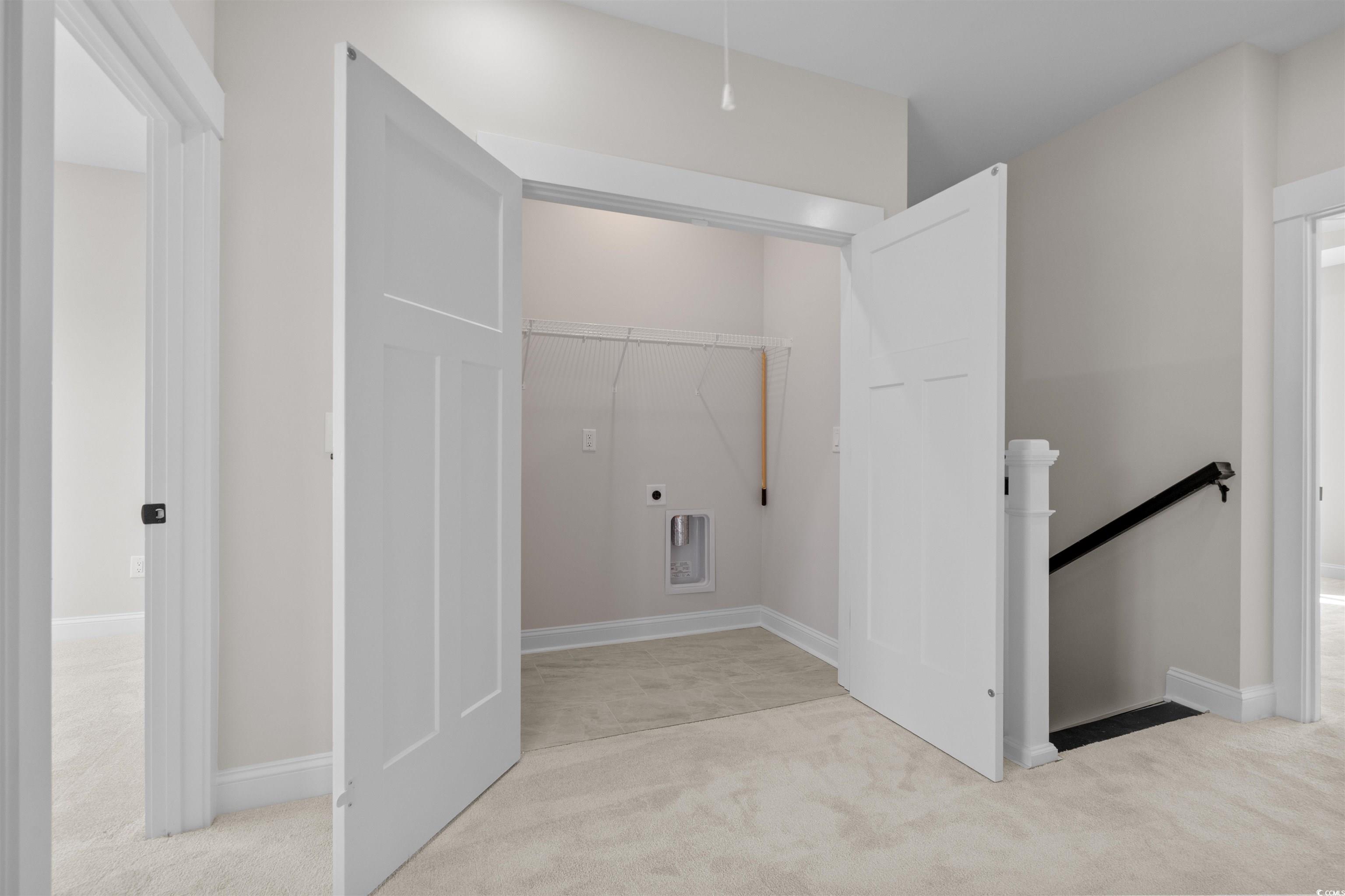 8476 Duke Place, Unit 32 Myrtle Beach, SC 29572 - Photo 23 of 40 Hall with light colored carpet and an upstairs landing