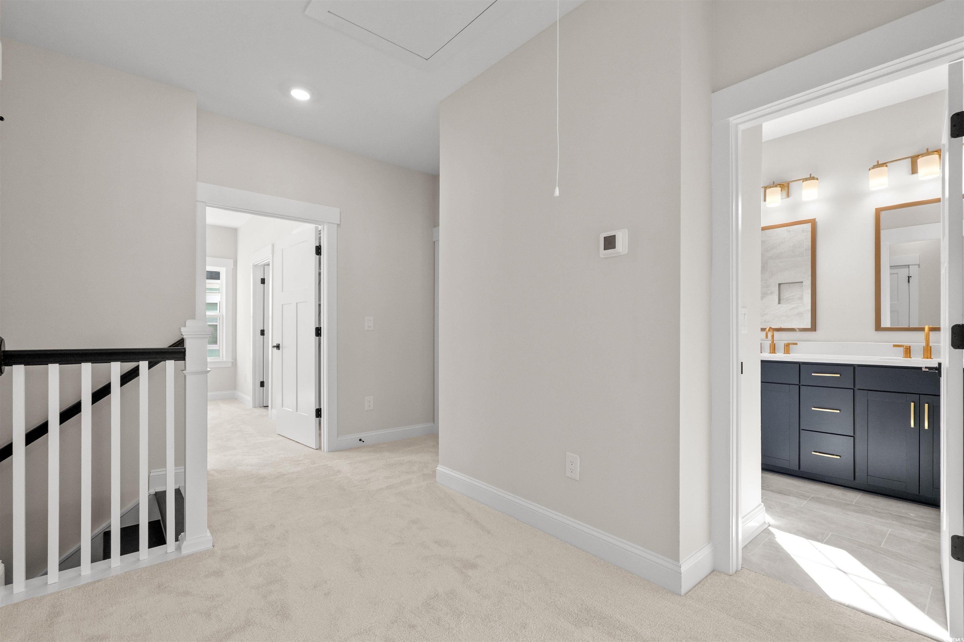 8476 Duke Place, Unit 32 Myrtle Beach, SC 29572 - Photo 24 of 40 Hallway featuring light colored carpet, an upstairs landing, recessed lighting, and attic access