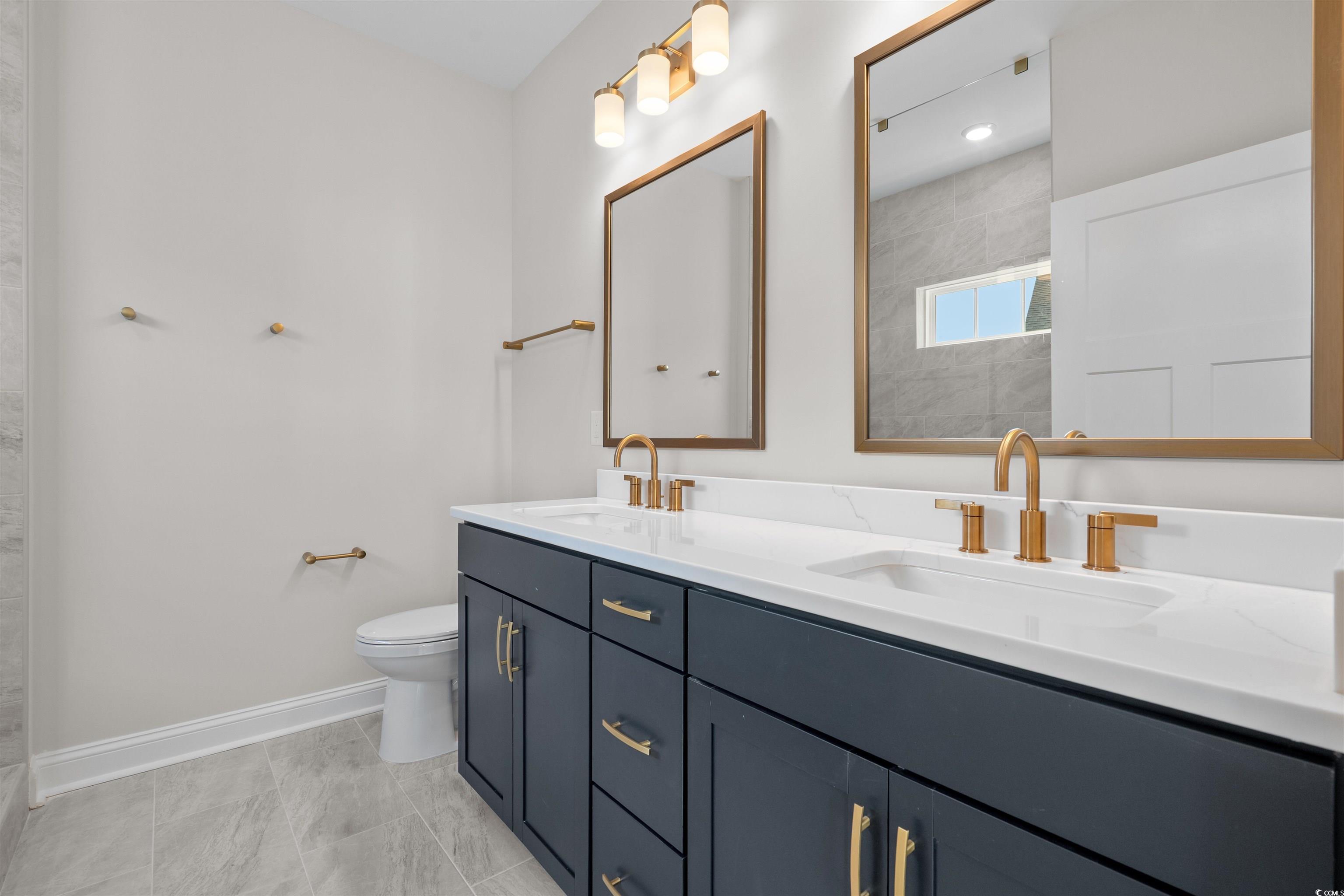 8476 Duke Place, Unit 32 Myrtle Beach, SC 29572 - Photo 27 of 40 Full bathroom with double vanity and a tile shower