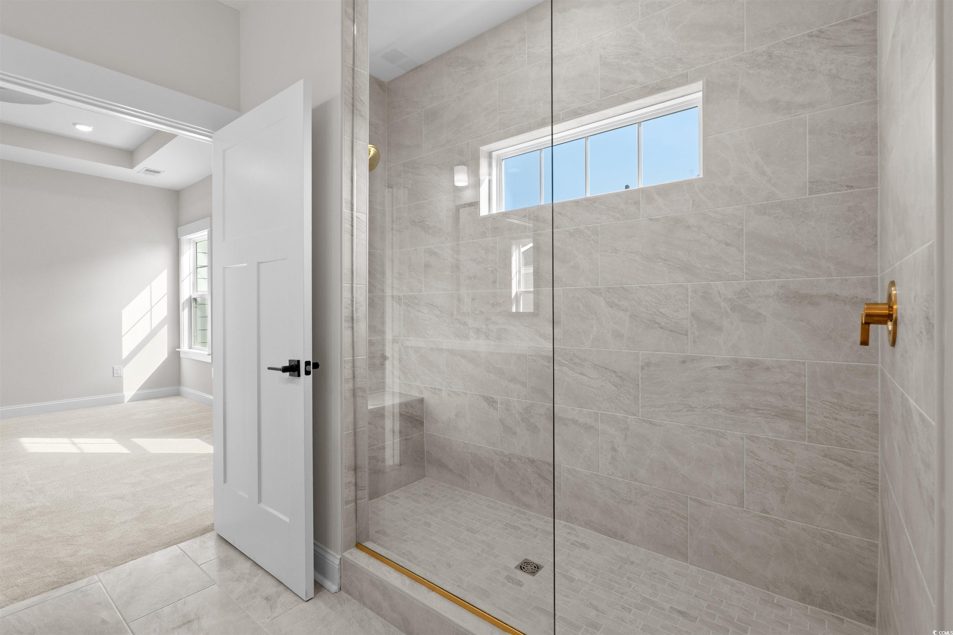 8476 Duke Place, Unit 32 Myrtle Beach, SC 29572 - Photo 28 of 40 Full bath featuring plenty of natural light, carpet flooring, and a walk in shower