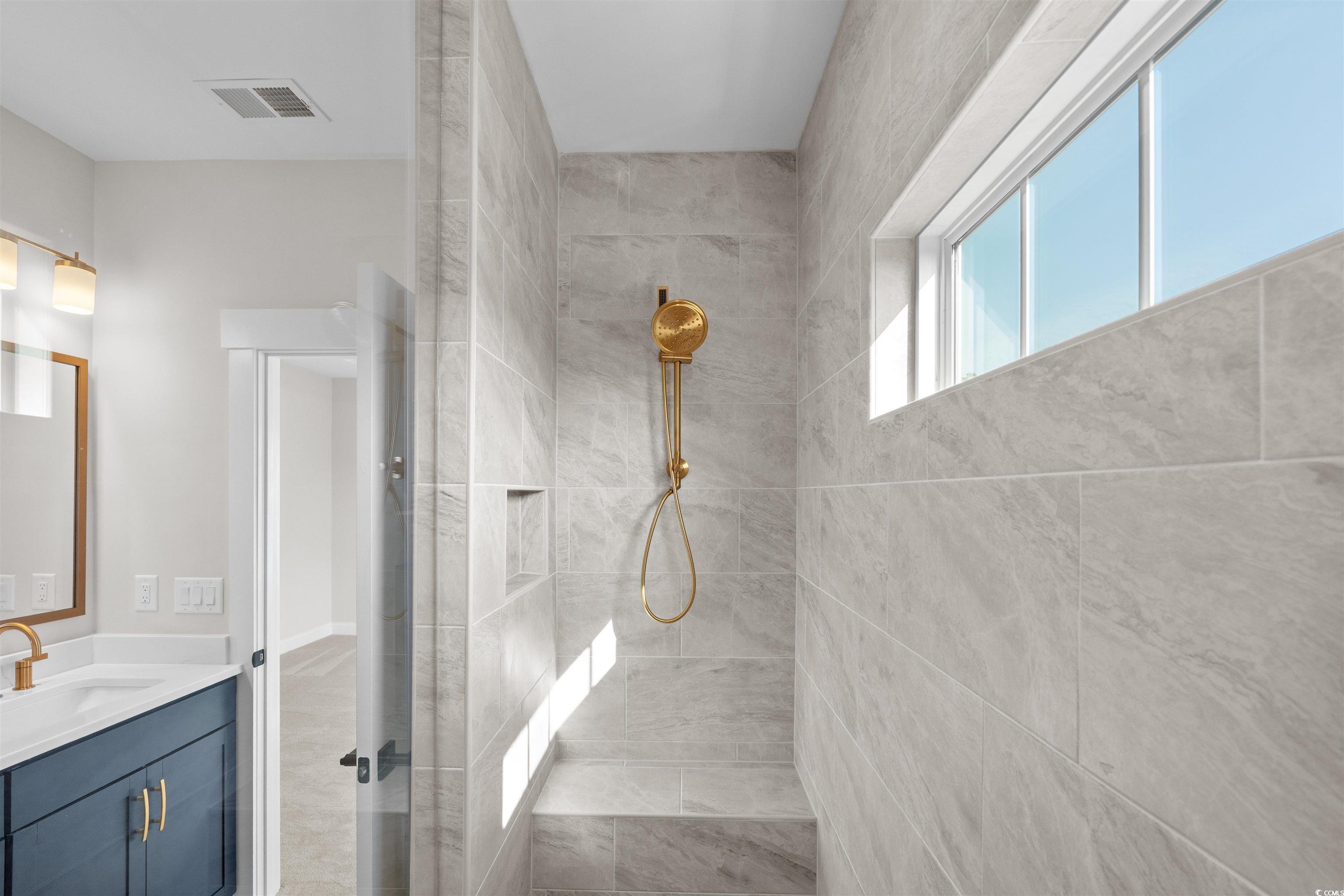 8476 Duke Place, Unit 32 Myrtle Beach, SC 29572 - Photo 29 of 40 Bathroom featuring vanity and a tile shower