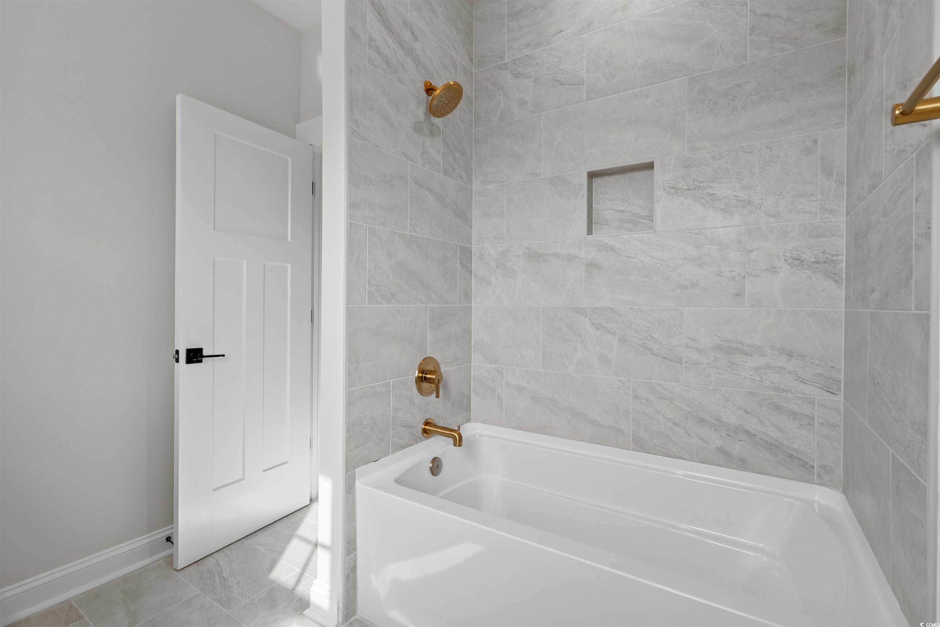 8476 Duke Place, Unit 32 Myrtle Beach, SC 29572 - Photo 35 of 40 Full bath with tub / shower combination and baseboards