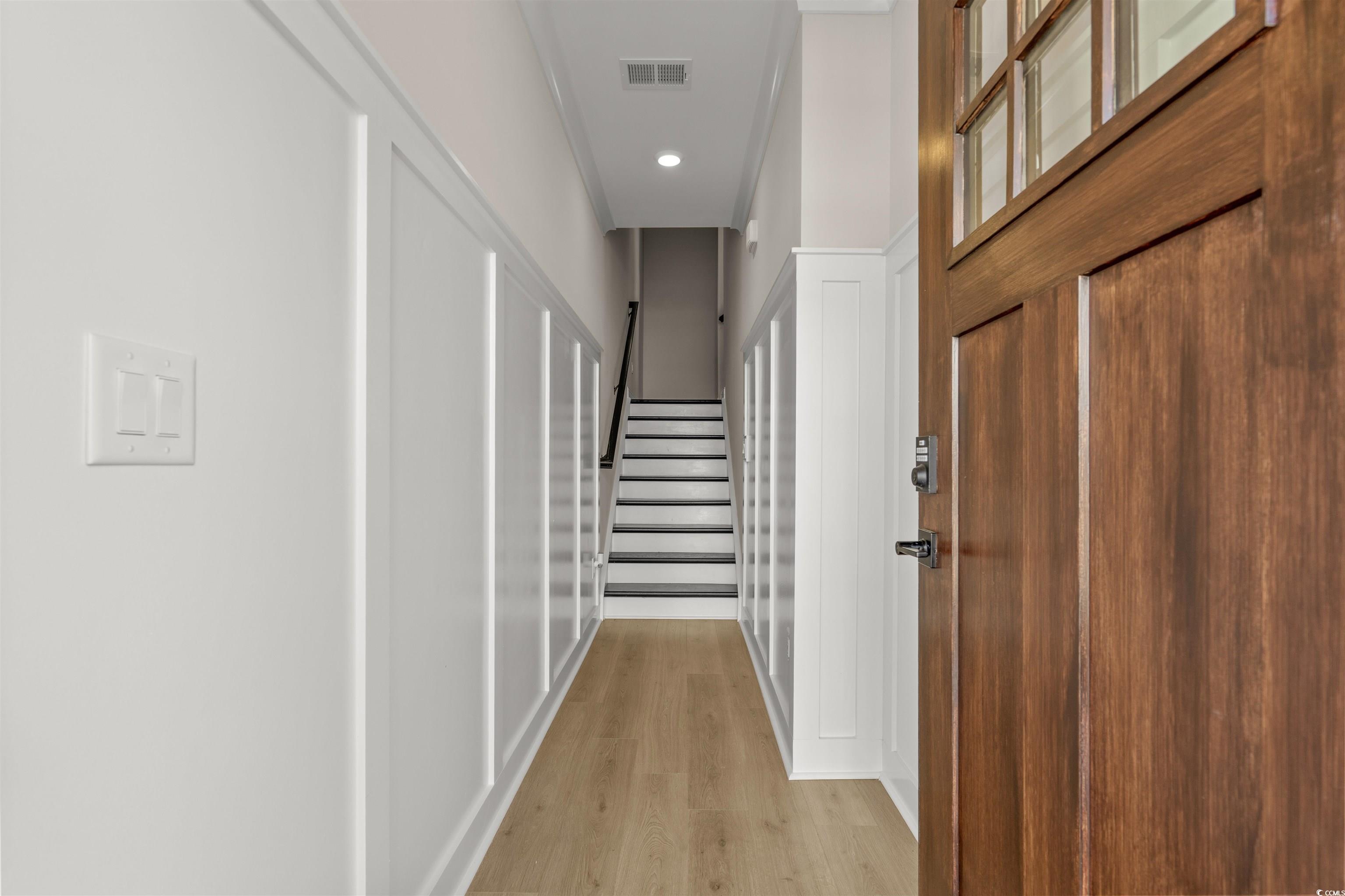 8476 Duke Place, Unit 32 Myrtle Beach, SC 29572 - Photo 5 of 40 Corridor with stairs, light wood finished floors, and recessed lighting