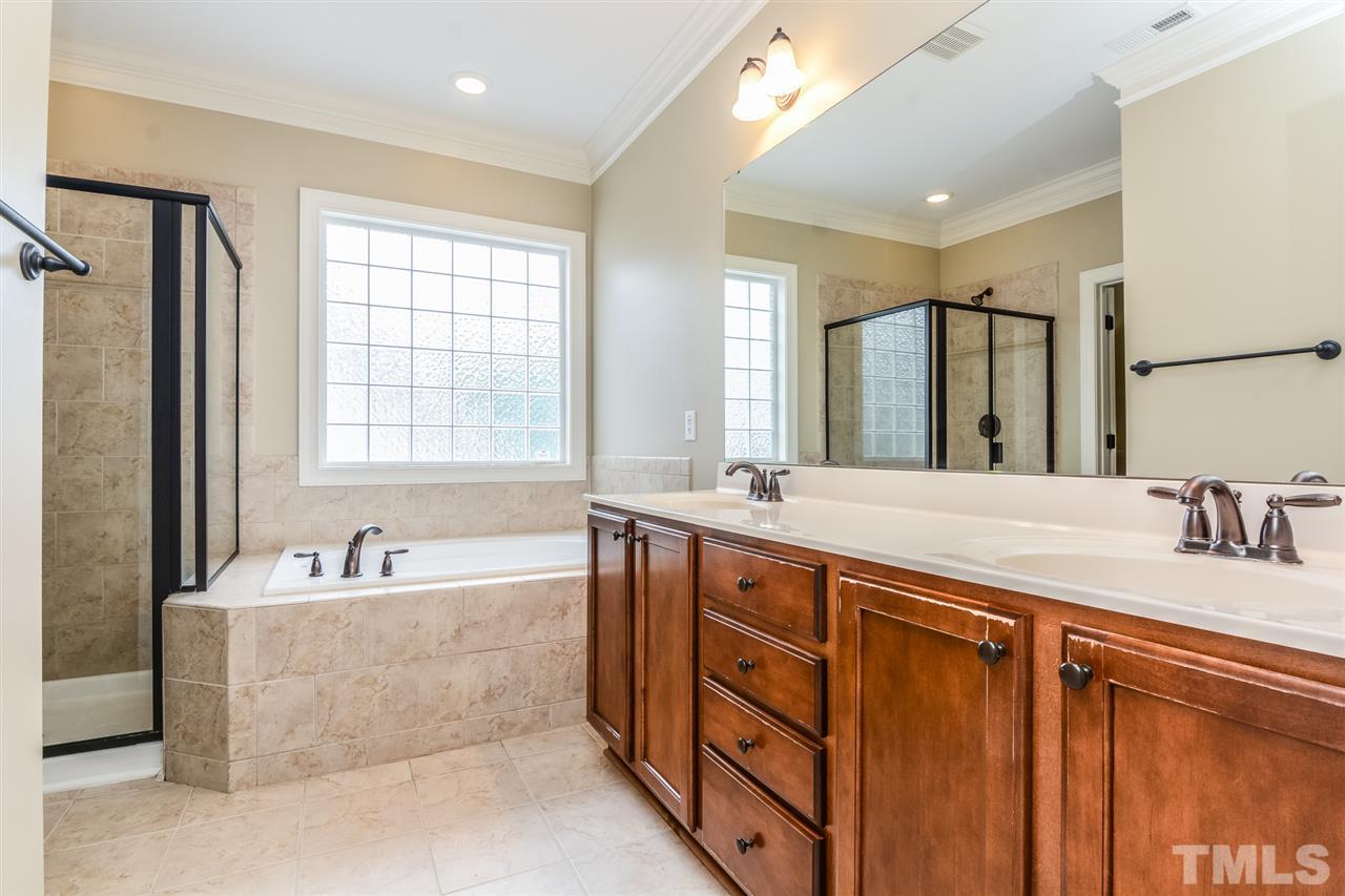 2261 Dunlin Lane Raleigh, NC 27614 - Photo 13 of 25 a spacious bathroom with sink double vanity shower and a bathtub