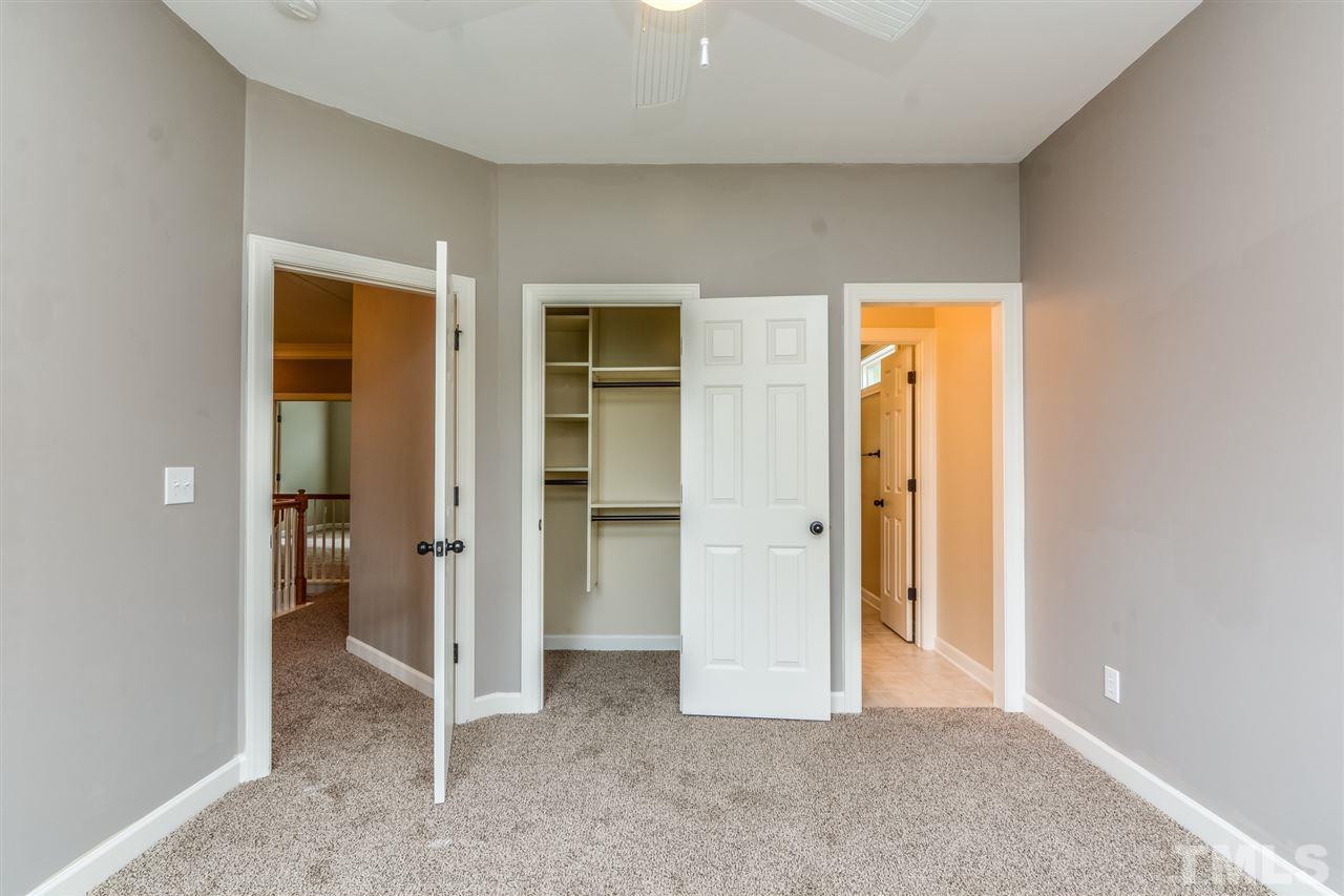 2261 Dunlin Lane Raleigh, NC 27614 - Photo 17 of 25 an empty room with closet and a bathroom