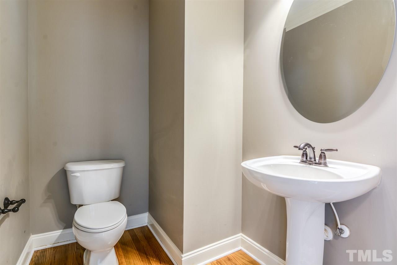 2261 Dunlin Lane Raleigh, NC 27614 - Photo 22 of 25 a bathroom with a sink toilet and a mirror