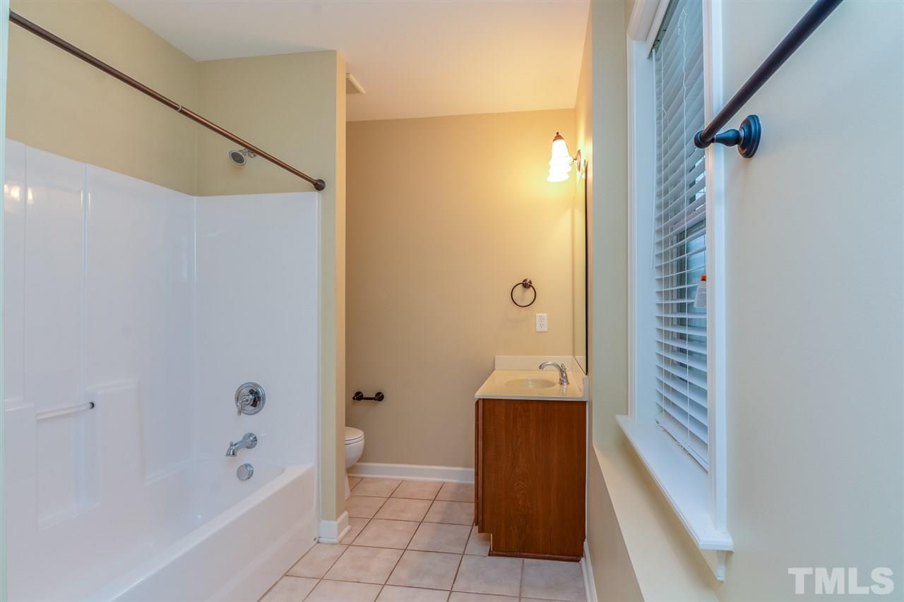2261 Dunlin Lane Raleigh, NC 27614 - Photo 23 of 25 a bathroom with a bathtub and a shower