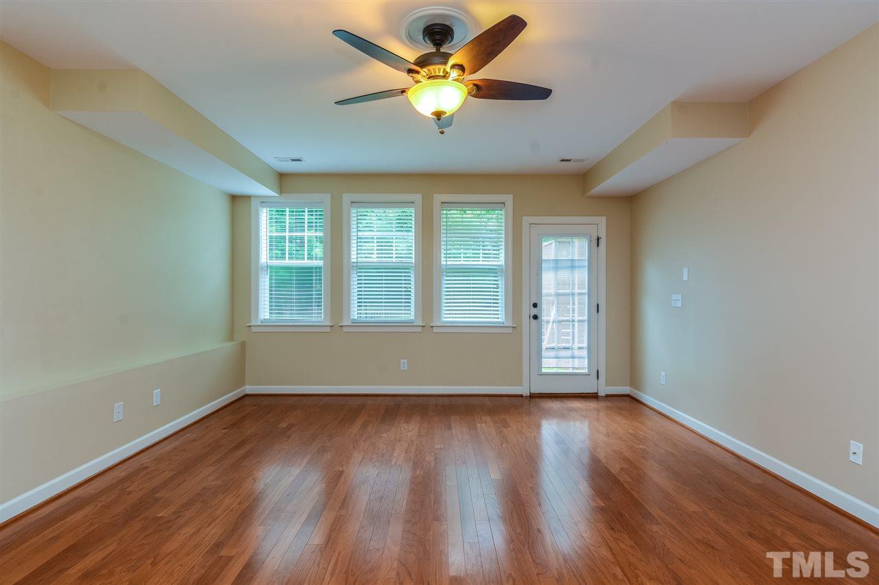 2261 Dunlin Lane Raleigh, NC 27614 - Photo 9 of 25 a view of an empty room with window and wooden floor