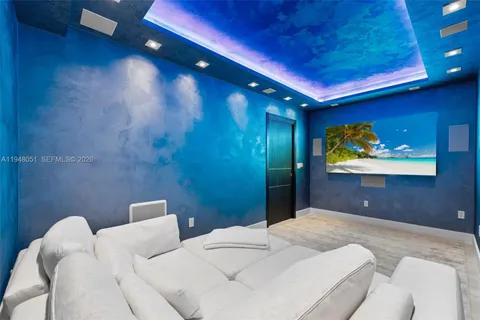 a en suite bathroom with a granite countertop sink and a mirror
