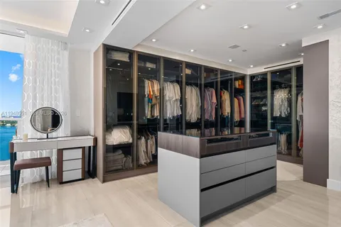 a room with a bed and a chandelier