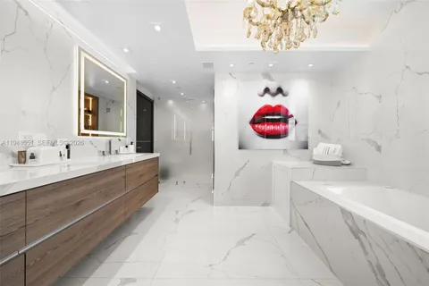 a living room with furniture and large windows