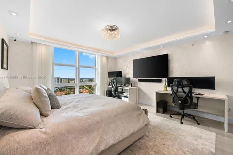 a view of a patio with a dining table and chairs under an umbrella