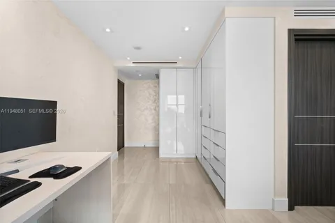 an aerial view of a house with a garden and swimming pool