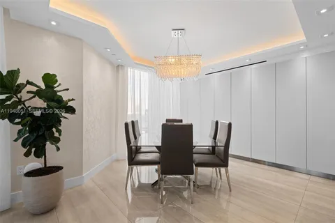 a view of a livingroom with furniture and a potted plant