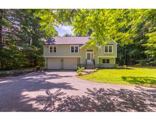 833 Edgell Road Framingham, MA 01701 - Photo 1 of 24 a front view of a house with a yard